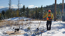 A pilot posing with a DJI Matrice drone